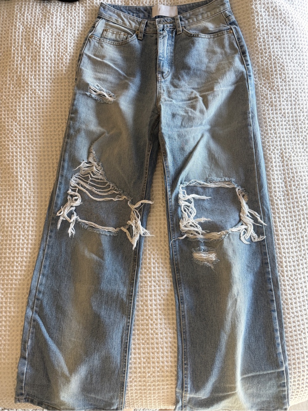 Blue distressed wide leg jeans